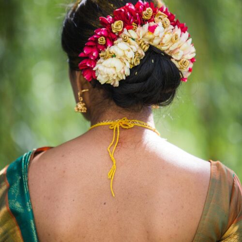 Indian wedding updo with flower
