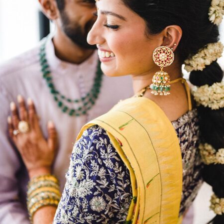 Long braided hair with flowers for indian wedding